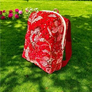 Red and White Floral Mini Backpack with Bold Design